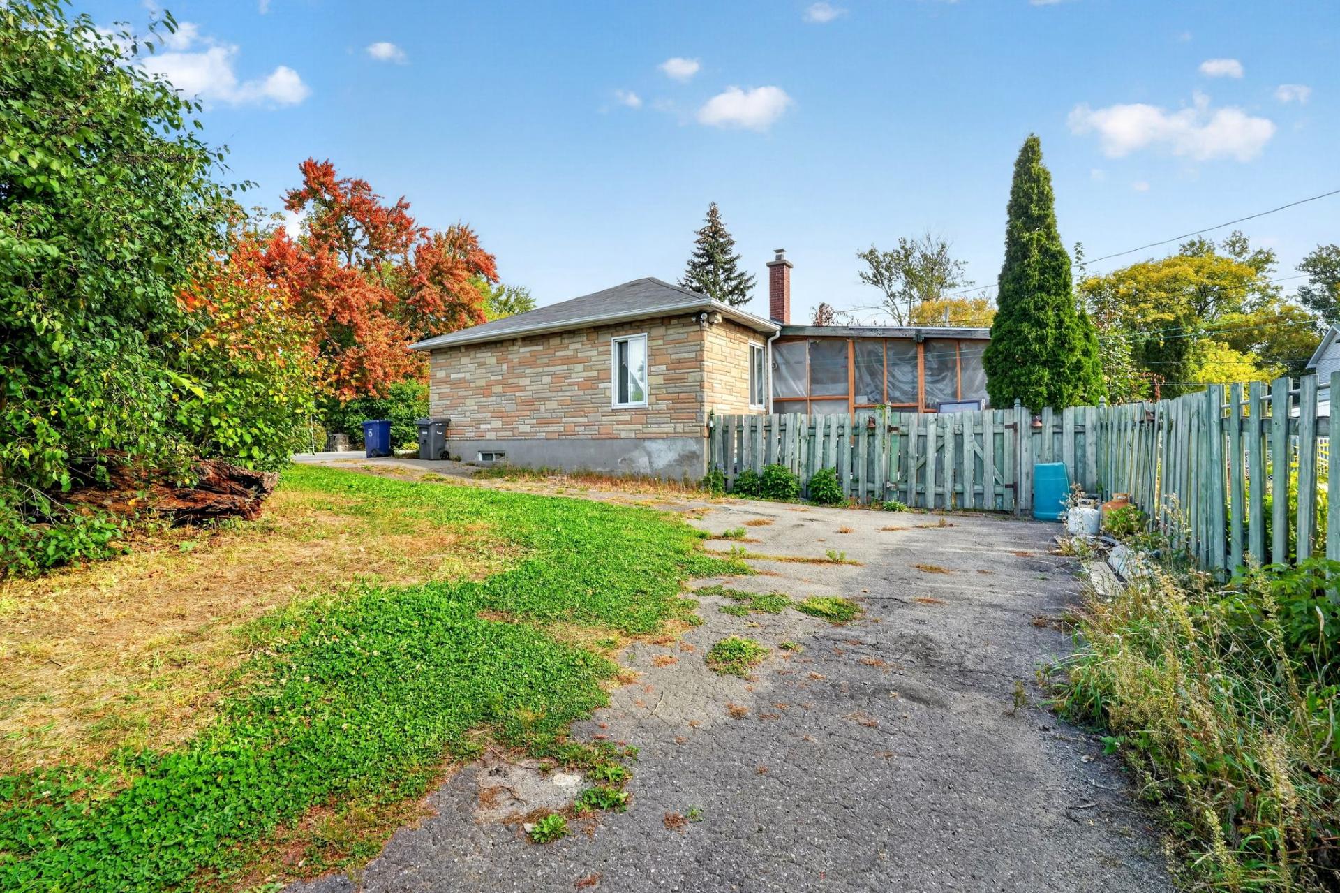 Back facade, lot for sale in Laval